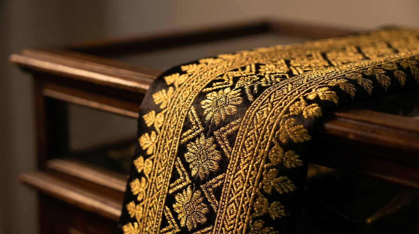 The Songket Heritage Discovery Box, filled with storytelling books, motif cards and a mini weaving frame